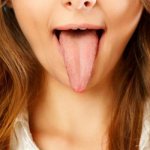 a woman has an itchy tongue